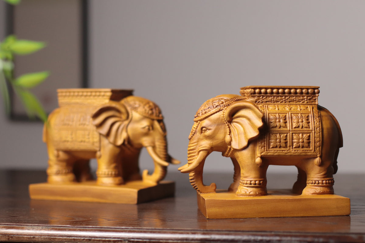Hand carved Cypress wood elephant tea light holder